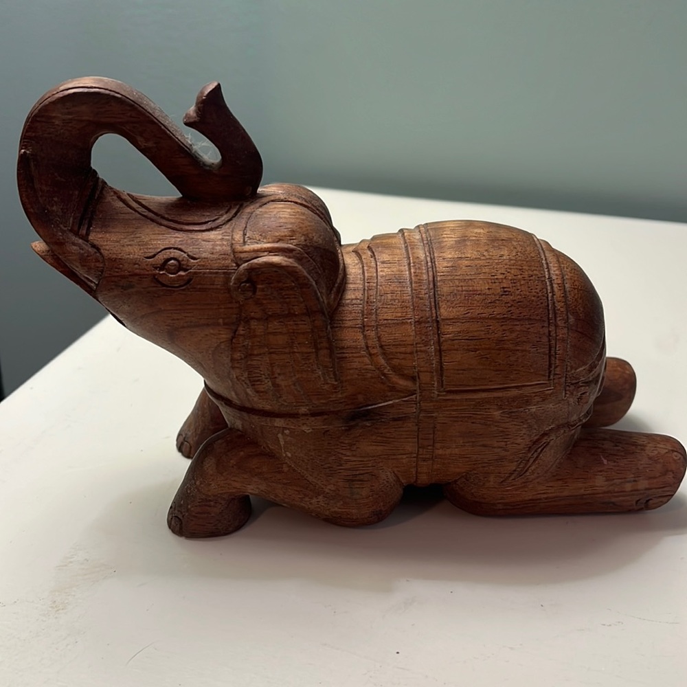 Small wooden elephant sculpture.